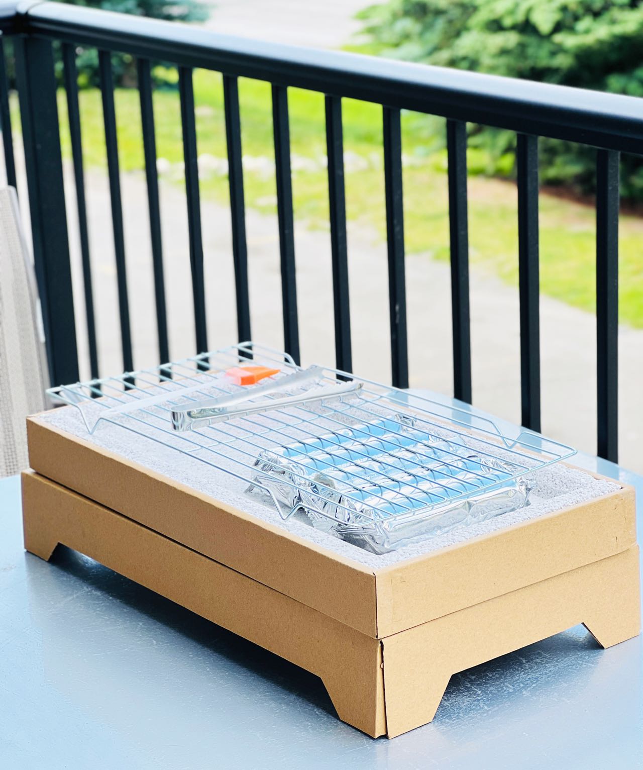 Compact EasyBBQ grill assembled on an outdoor table