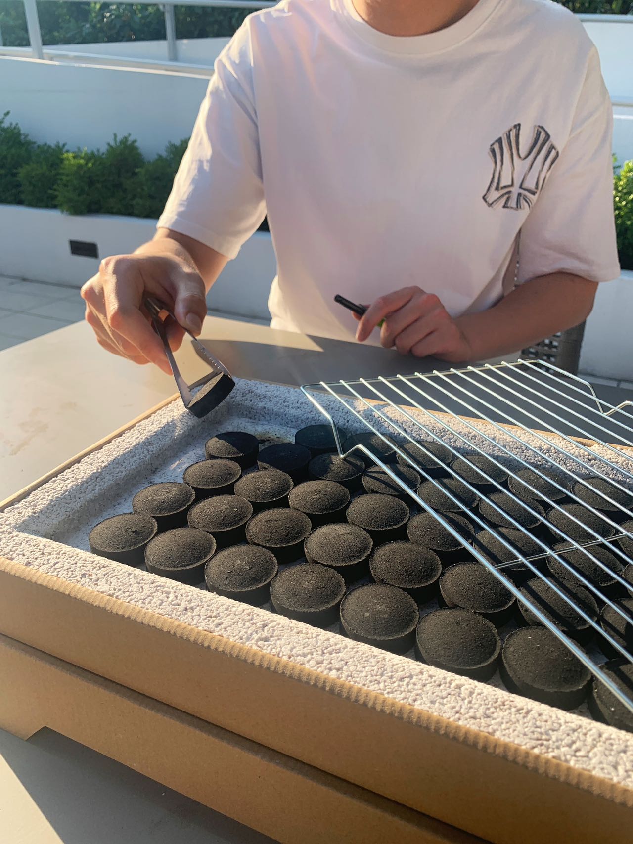 Charcoal arranged closely inside the EasyBBQ grill